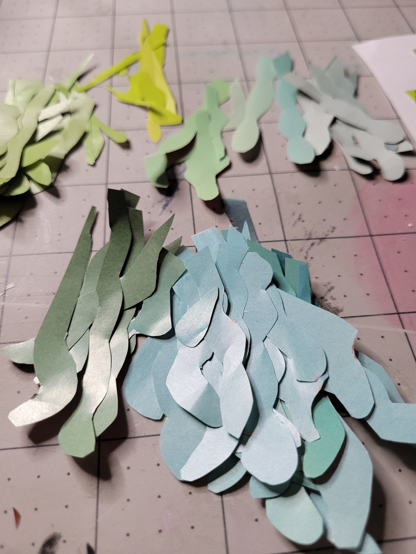 Hand-cut reclaimed paper pieces prepared by Dawn Leigh during the creation of Diversity.