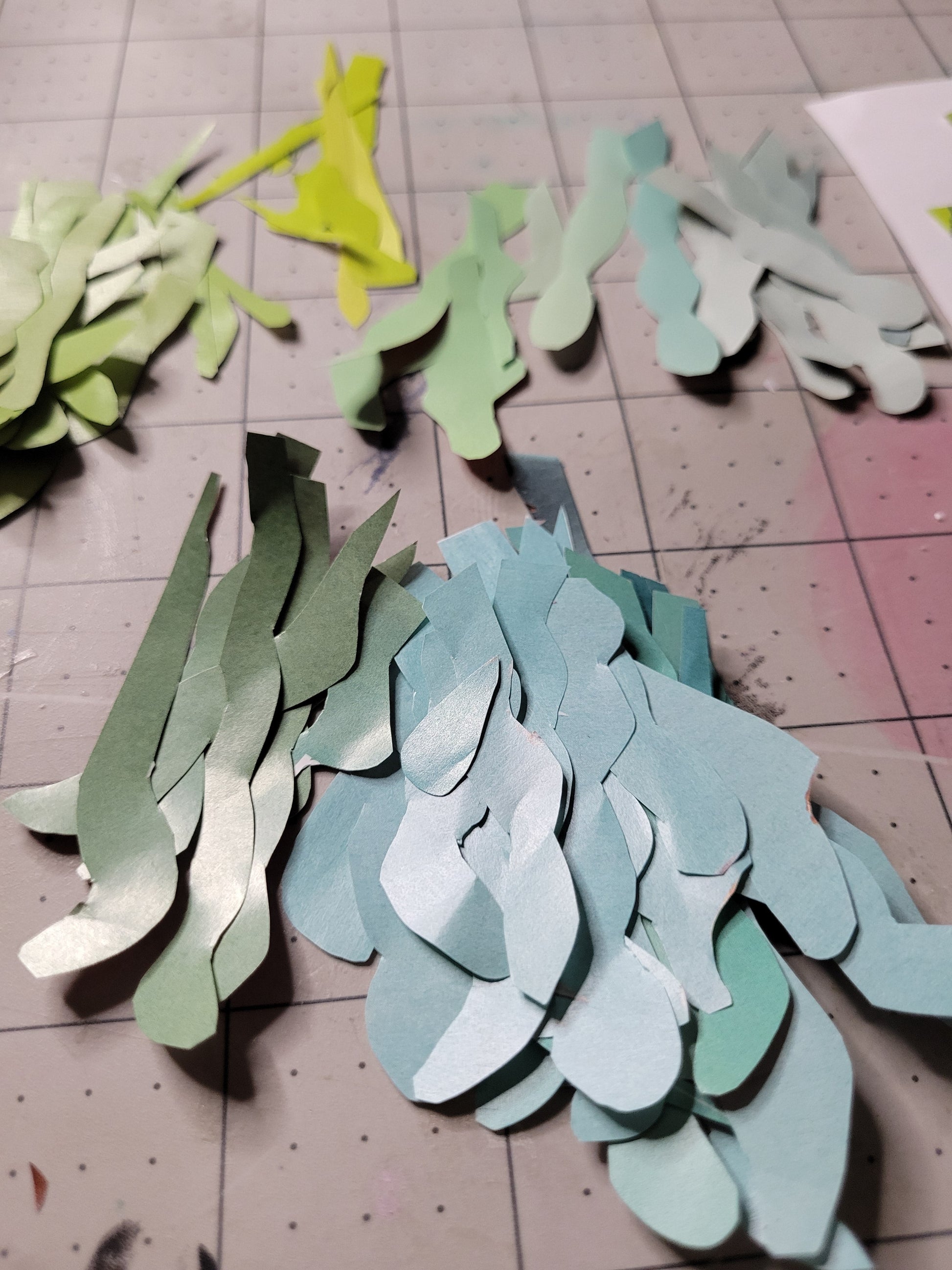 Hand-cut reclaimed paper pieces prepared by Dawn Leigh during the creation of Diversity.