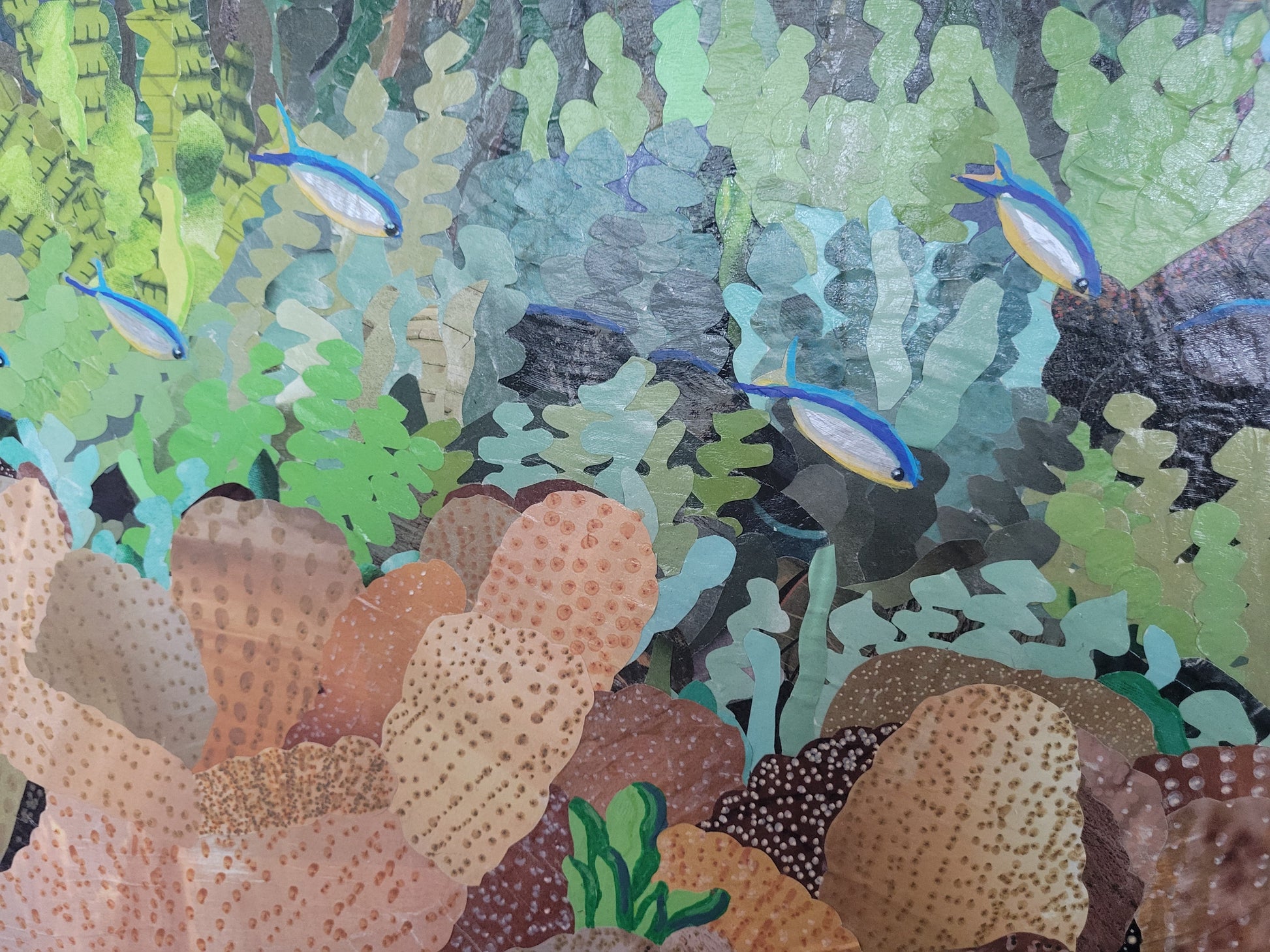Detail of Diversity by Dawn Leigh showing colorful fish, coral, and marine plants created from layered hand-cut reclaimed paper.