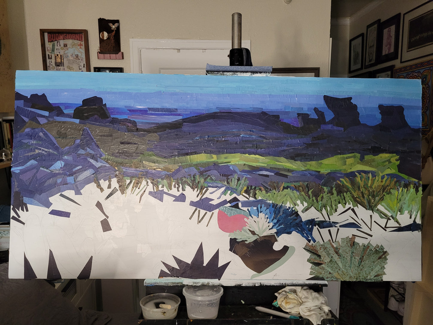 Diversity by Dawn Leigh in progress on the easel, showing the layered reclaimed-paper marine ecosystem taking shape.